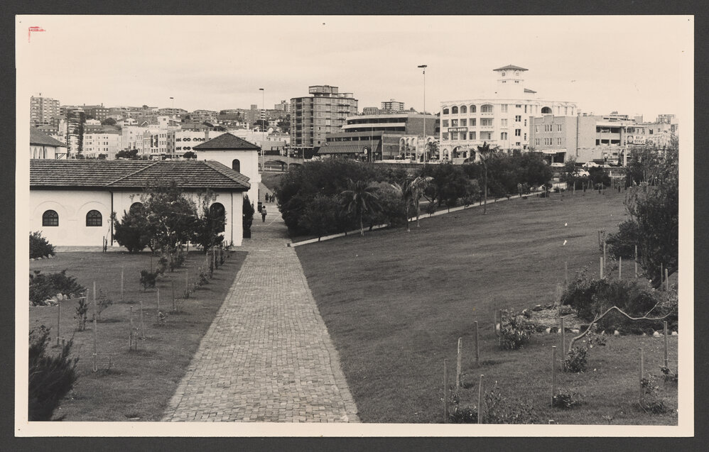 North west corner of Pavilion, Bondi beach Park, and Hotel Bondi ( painted white ).