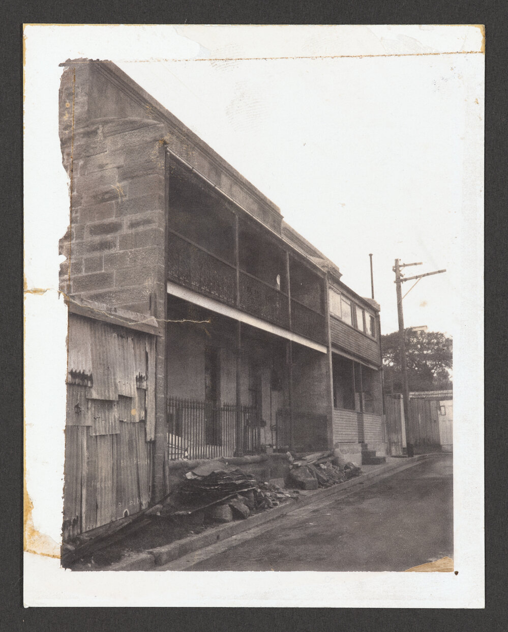1-2 Fitzgerald Lane, Bondi Junction, off Birrell Street. Two storey stone terraces. Prior to being renovated. National Trust listed.
