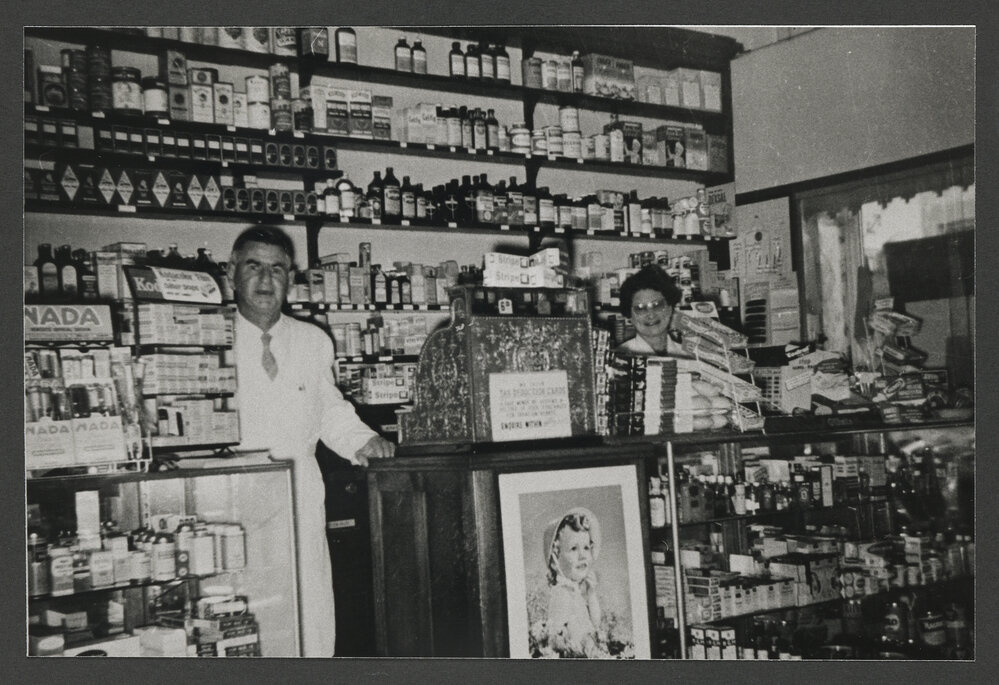 Bell's Pharmacy, 15 Bronte Road, Bondi Junction. Interior, with chemist and shop assistant.