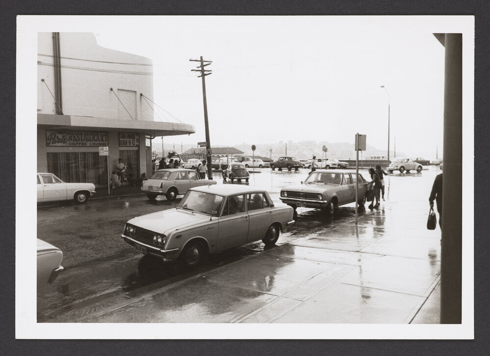 Roscoe Street, Bondi beach, corner Campbell Street Parade. Bondi Pavilion, centre background.