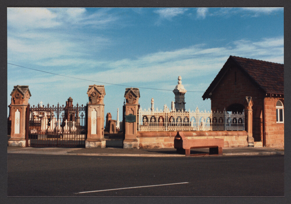 Waverley Cemetery, Restored portion of sandstone and wrought iron fence, right of main entrance gates. Horse trough and waiting shelter.