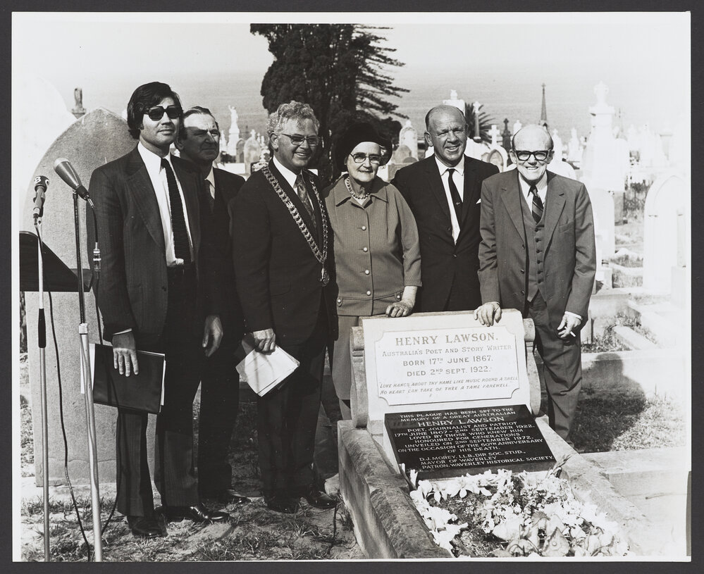 Grave of Henry Lawson. 50th Anniversary memorial service at Waverley cemetery. Left to right, Lew Luton; Peter Daly, President of the Waverley Historical Society; Alderman D. J. Morey, Mayor of Waverley; Mrs Bertha Jago, daughter Henry Lawson; Professor C