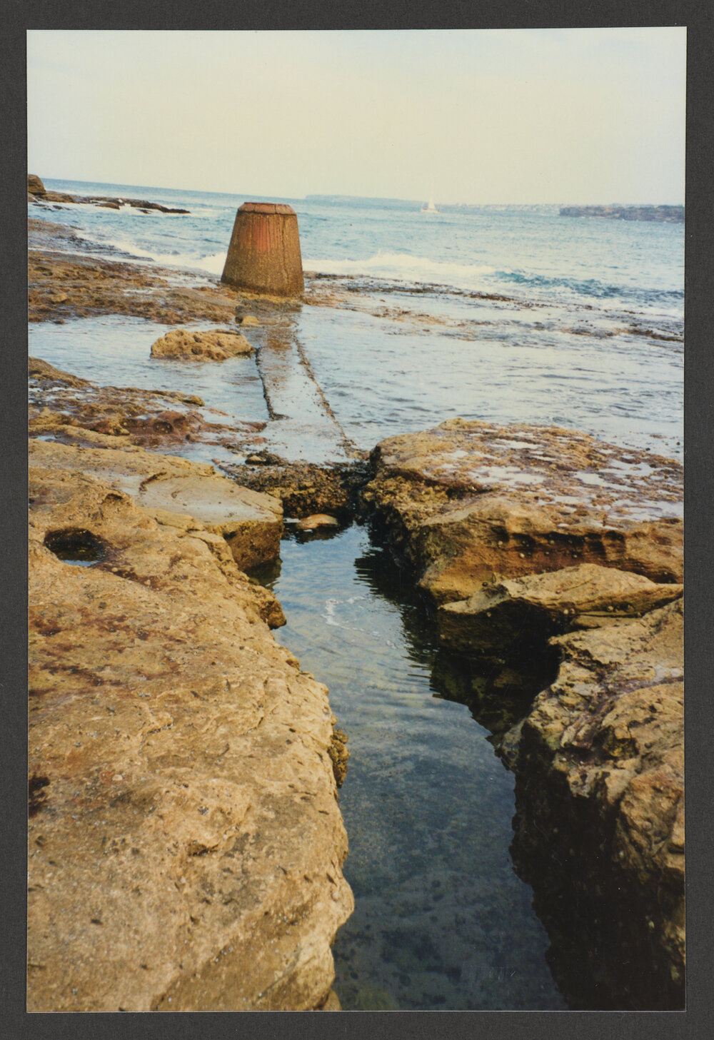 Bondi beach, storm water outlet and channel, rocks. North Bondi
