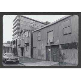 20A Spring Street, Bondi Junction one of the oldest Iron Buildings in Bondi Junction, used as stables and for Chaff cutting. Bondi Junction Motel Looms in background.