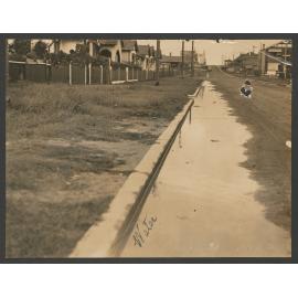 Our newly made portion of Matilda Street, Bondi. After a shower we can hardly get out of the street. The rest of the week the water lays in the gutter. Then we are smothered in dust from parts that dry up. Can it be tarred or something done to rectify all