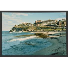 Bronte beach covered in smelly seaweed, looking south