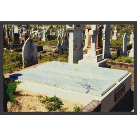 Double grave with two flat grey marble slabs