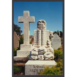 Open book headstone, calvary cross on left