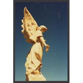 Angel holding flowers, white marble