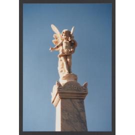 Cherub above pedestal