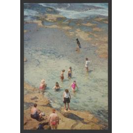 MacKenzie's Bay, with people on rocks swimming in bay