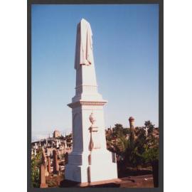 Shroud draped obelisk on pedestal