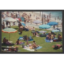 Bronte beach , sunbathers on grass and sand