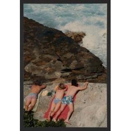 MacKenzie Bay, sunbathers on rocks.