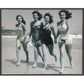 Beach girls running out of water, Bondi beach : Norma Weston, Judith ( Judy ) Parnell,  Monica Kelly, Patty Jupp.  Girls aged approx. 16 years old.