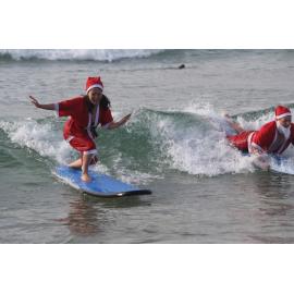 Most surfing Santas