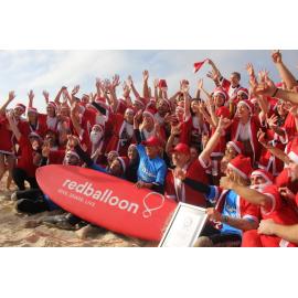 Most surfing Santas