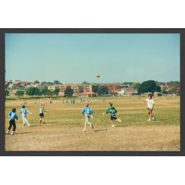 Peter Tos, Coach of Bondi Raiders Gridiron with children in Queens Park.