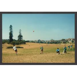 Peter Tos, Coach of Bondi Raiders Gridiron with children in Queens Park.