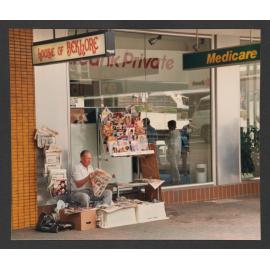 Paper seller in Oxford Mall, Bondi Junction.